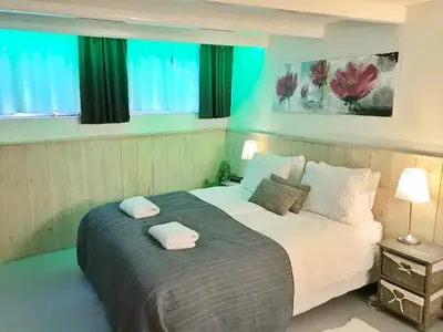 a bedroom with a bed with two towels on it at Amsterdam Home in Amsterdam