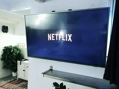 a flat screen tv hanging on a wall at Amsterdam Home in Amsterdam