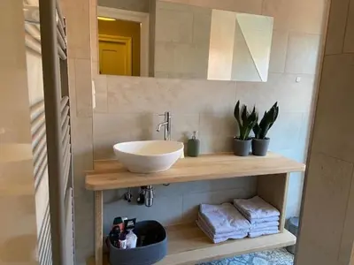a bathroom with a sink and a mirror at Het Schaager Waapen in Alkmaar