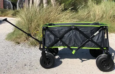 a green and black cart sitting on the ground at Villa Klein Geluk in Egmond aan Zee