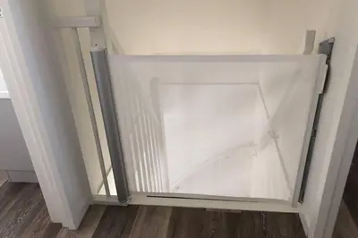 a sliding glass door in a room with a wooden floor at Villa Klein Geluk in Egmond aan Zee