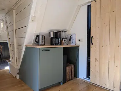 a kitchen with a counter with appliances on it at StoreStay DamSquare in Amsterdam