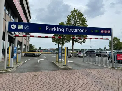 a parking sign for a parking dealership in a parking lot at Triple G Hotels in Amsterdam