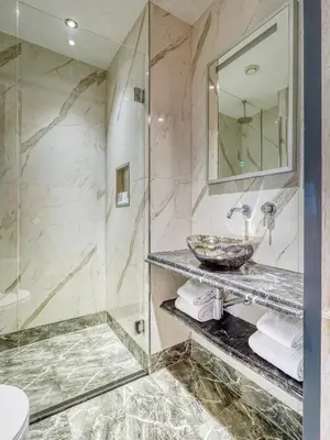 a bathroom with a sink and a shower at Triple G Hotels in Amsterdam