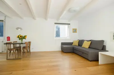 a living room with a couch and a table at Green Alley Studio in Amsterdam