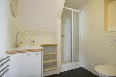 a bathroom with a toilet and a sink and a shower at Green Alley Studio in Amsterdam
