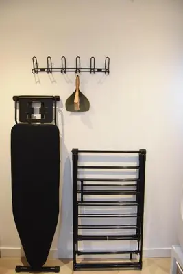 a black metal rack next to a wall at In de bocht in Heiloo