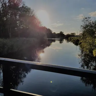 a view of a river from a bridge at In de bocht in Heiloo