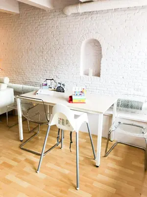 a white desk with a chair in a room at KG House in Amsterdam