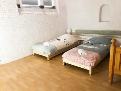two twin beds in a room with at KG House in Amsterdam