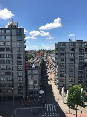 a view of a city street with tall buildings at Six in Amsterdam
