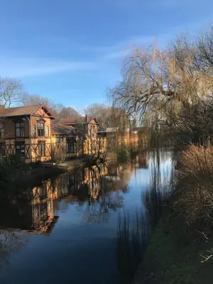 a view of a river with houses in the background at Six in Amsterdam