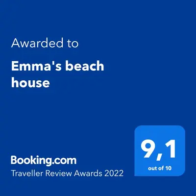 a screenshot of a phone with the text awarded to emmas beach house at Emma's beach house in Katwijk aan Zee