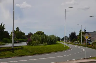 an empty street with street lights on the side of a road at Froukje's B&B in Woerdense Verlaat