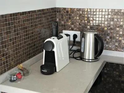 a kitchen counter with a toaster and a coffee maker at Huis Zeeduin Amsterdam Beach in Zandvoort