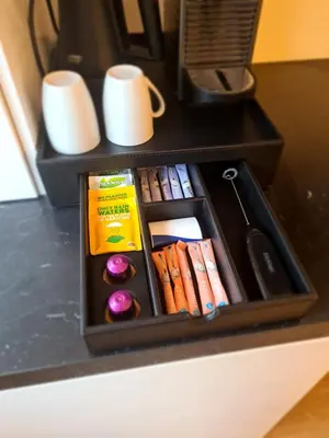a drawer filled with books on a desk at Studio Baarn with patio, airco, pantry, bedroom, bathroom, privacy - Amsterdam, Utrecht in Baarn