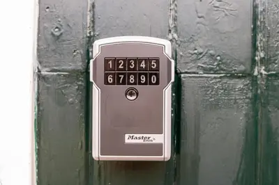 an alarm clock is attached to a door at Studio Baarn with patio, airco, pantry, bedroom, bathroom, privacy - Amsterdam, Utrecht in Baarn