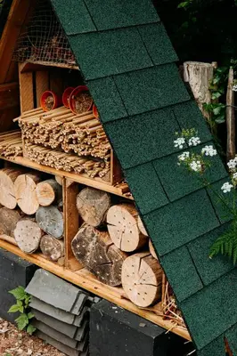 a close up of a house with logs and a roof at Boutique B&B Oud Aa in Breukelen