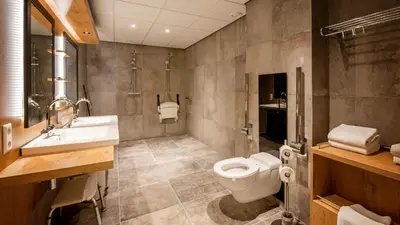 a bathroom with a toilet and a sink at De Egmonden in Egmond aan Zee
