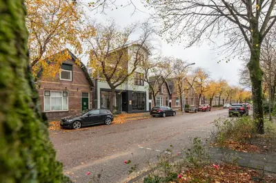 a street with cars parked on the side of the road at Boutique Hotel 43 Amsterdam - Zaandam in Koog aan de Zaan