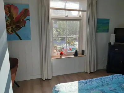 a bedroom with a window and a bed in it at B & B Tulp Amsterdam Noord in Amsterdam