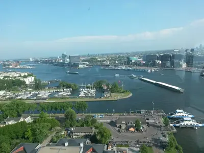 an aerial view of a river with boats docked at B & B Tulp Amsterdam Noord in Amsterdam