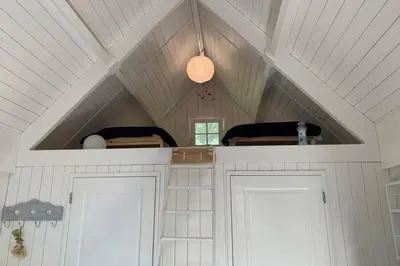 a kitchen with two white doors and a ceiling at Bergen, Huisje dat ademt zee en vakantie... in Bergen