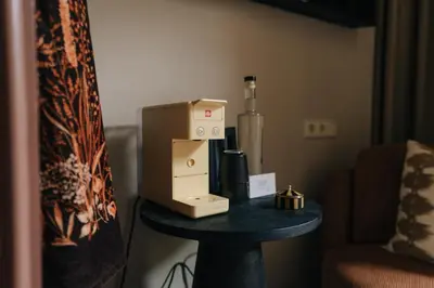 a coffee machine sitting on a table in a room at Hotel Omega in Amsterdam