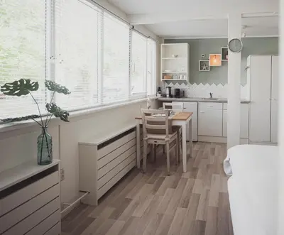a kitchen with a table and a dining room at B&B Het Ruime Sop in Wassenaar