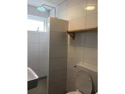 a bathroom with a toilet and a sink at Vakantiewoning Van der Meer, Egmond aan Zee in Egmond aan Zee