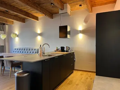 a kitchen with a sink and a counter top at Pakasa in Leiden