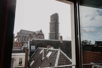a view of a city from a window at The Nox Hotel in Utrecht