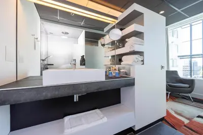 a bathroom with a sink and a mirror at Fletcher Wellness-Hotel Leiden in Leiden