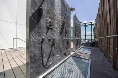 a metal wall with horseshoes on the side of a building at Fletcher Wellness-Hotel Leiden in Leiden