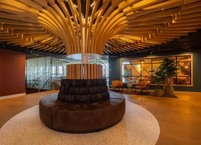 a lobby with a large ceiling with a large sculpture at Fletcher Wellness-Hotel Leiden in Leiden