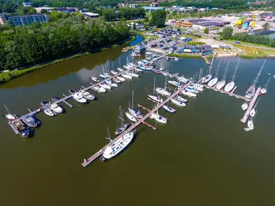 an aerial view of a marina with boats in the water at Kaap Hoorn Club Bed en Breakfast in Hoorn