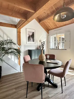 a dining room with a table and chairs at Noxem b&b in Boesingheliede