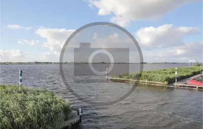 a view of a body of water with a pier at Aqualiving Kempers in Aalsmeer