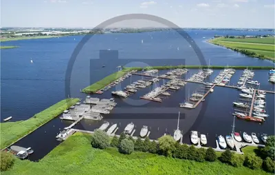 an aerial view of a marina with boats in the water at Aqualiving Kempers in Aalsmeer