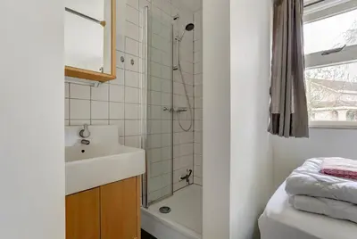 a bathroom with a sink and a shower at Villa Leeuwerik (4-12 p.) in Zeewolde