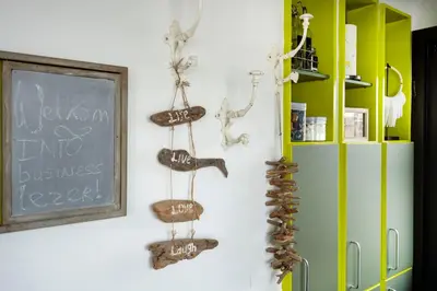 a wall with several different types of objects on it at Aangenaam op de Rijn, woonboot, inclusief privé sauna in Alphen aan den Rijn