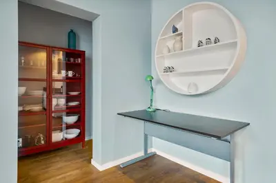 a dining room with a table and a mirror at Five Churches View apartments in Haarlem