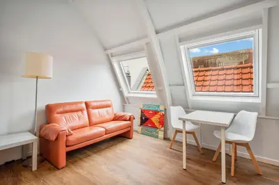 a living room with a couch and a table at Five Churches View apartments in Haarlem