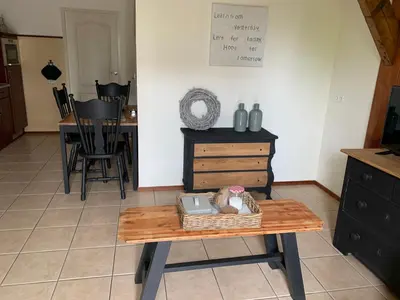 a living room with a table with a basket on it at Christinahoeve Logies Oude Deel in Boskoop