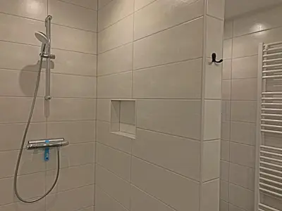 a bathroom with a shower with a glass door at Christinahoeve Oude Deel #4 in Boskoop