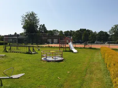 a park with a playground with a slide at Lovely Bungalow 8p close to beach and Amsterdam in Opmeer