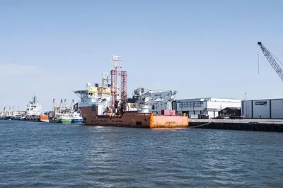a large ship is docked in the water at Harbour Hotel IJmuiden in IJmuiden