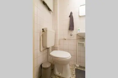 a bathroom with a toilet and a sink at Charming apartment in city center in Amsterdam