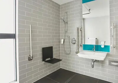 a bathroom with a sink and a shower at Holiday Inn Express - Almere by IHG in Almere