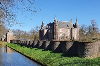 an old castle on a bridge over a river at Hotel Flora Batava in Breukelen